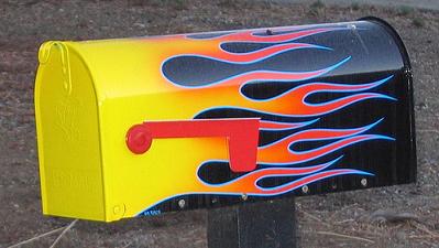 Mail box with flames painted on the side
