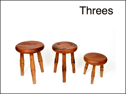 Three three-legged stools